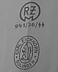 1936: Transitional mark showing both the early double oval and RZM